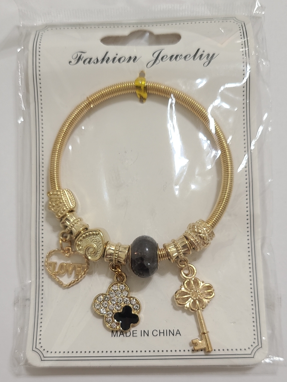 Fashion Jewelry Gold-Tone Bracelet w Black Accent Bead, Heart, Clover Key Charms